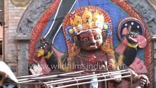 People worship 'Kala Bhairava' statue in Durbar Square, Nepal
