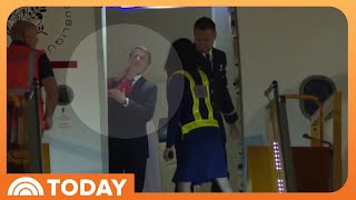 Macron downplays video appearing to show his wife push his face