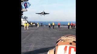 Landing of f-18 super hornet fighter jet on aircraft carrier