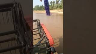 Kubota harvester crossing godavari