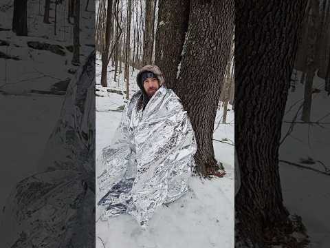 Pocket sized heated survival shelter