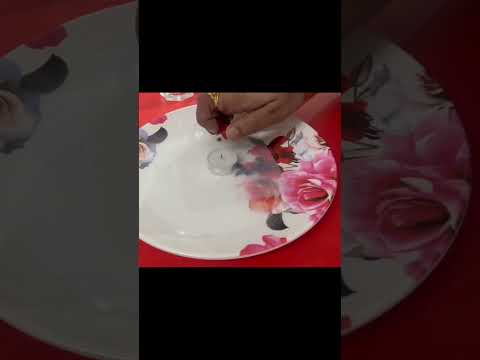Science experiment of water with candle in glass