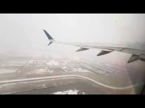 UA1953 snowy and blurry afternoon takeoff YYC