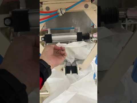 Pallet dispenser with bulk bag filler roller conveyors