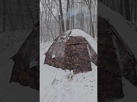 Camping out in the hot tent during a November snow storm