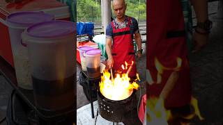 Stir-fried seafood noodles served on the spot with a fire show!