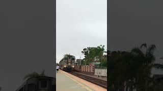 Pacific Surfliner 6951 leads 1777 through Carlsbad Village with a interesting 4 car consist