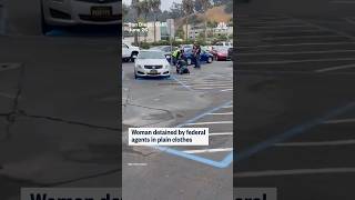 Woman detained by federal agents in plain clothes