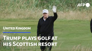 Donald Trump hits Scottish golf course as protesters rally | AFP