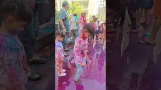 "Drenched in colors, soaked in happiness! 🌸💙 #HoliFun"
