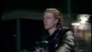 Young guy gets on his black leather jacket - Part 2