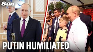 Sheepish Putin steps out to meet sailors after cancelling navy parade over 'security reasons'