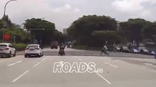 Cyclist dangerously cycling across the road even when pedestrian crossing is red