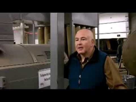 Dusting Rugs at World's Largest Rug Cleaning Plant