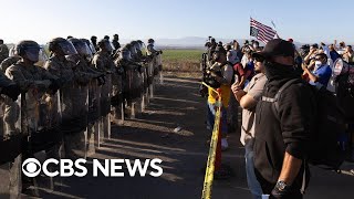 Migrants hide from ICE agents after farm raid, clash with protesters