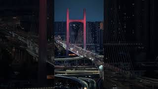 The dazzling night lights of Zhengzhou's Nongye Road Overpass guide countless vehicles homeward.