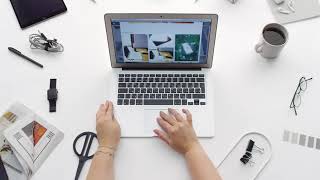 Office Stock Footage - Woman Scrolling/Working On Laptop - 4k Free Workspace Background
