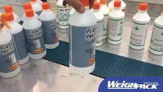 Wraparound labeler for liquid bottles