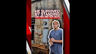 This man survived the deadly floods by swimming outside and standing on his home's meter box.