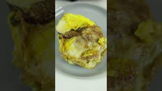 Frying a BALUT egg (fertilized duck)