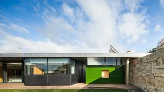 Black Concrete Building Displaying a Minimalist Architecture: House in Mosteiro
