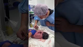 Tatay is cutting Elisha Rapha's umbilical cord. #babyboy #newborn #miraclebaby