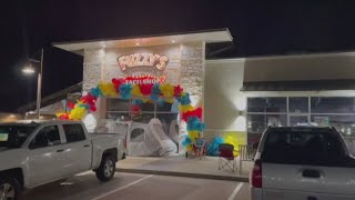 Customers camp overnight for Fuzzy's Taco Shop on West Adams grand reopening