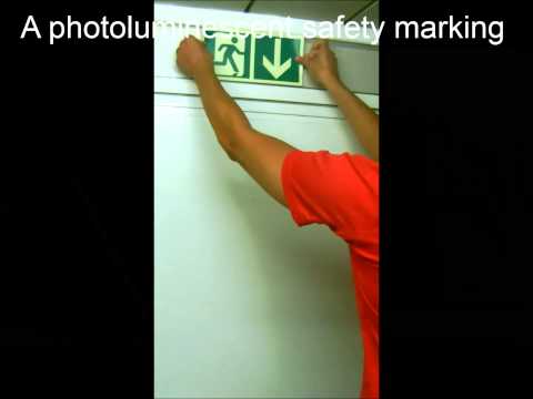 Photoluminescent adhesives for emergency exits