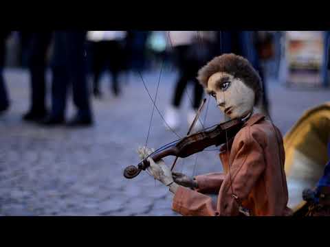 Strings (short cinematic film with wired doll playing a tiny violin)