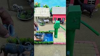 mini cow bathed with mini hand pump making