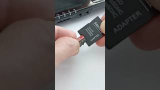 Inserting a micro SD into the adapter to be plugged into the SD slot on a laptop like this #shorts