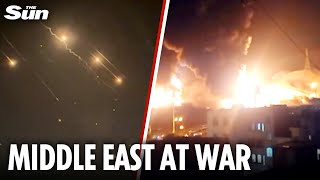 Iran fires barrage of missiles at Israel as IDF strikes oil depot and says 'Tehran is burning'