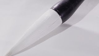 How are brush pens made traditionally?