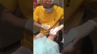 Dentist gives quick examination of woman’s teeth #dentalexam