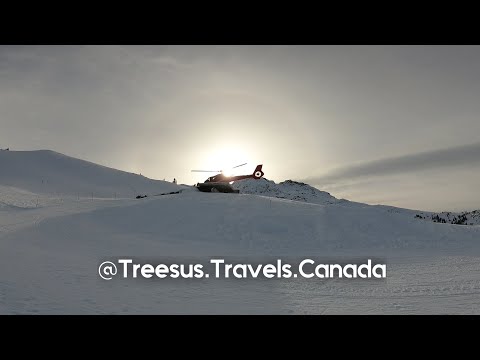 Helicopter landing at the top of Whistler Mountain