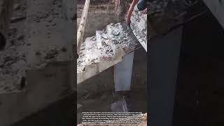 Cutting Reinforcing Steel Rods Inside Concrete Stairs During Structural Work
