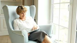 Senior Attractive Woman Sits And Websurfing On Internet With Tablet Computer (Stock Footage)