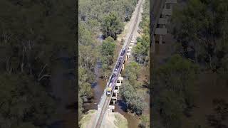 VLocity Train crosses flooded Honeysuckle Creek #railway #train #drone