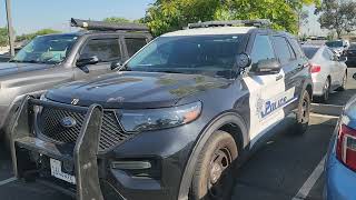 Why is a police cruiser running in a parking space for hours at the Courthouse?