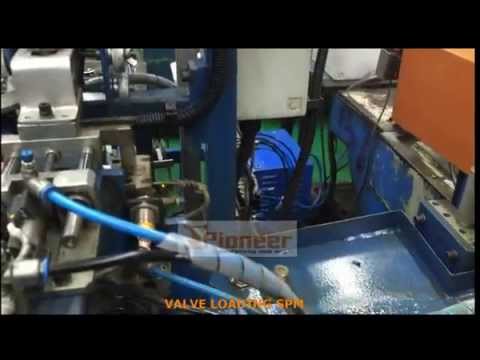Valve Loading into Centerless Grinding Machine.