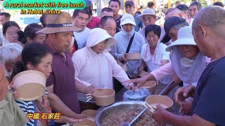 Free lunch at a rural market in Shijiazhuang, China, and delicious stews