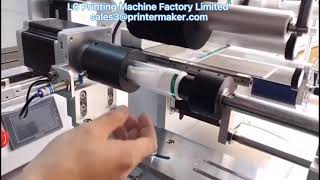 Semi-automatic labeling machine for oval bottles