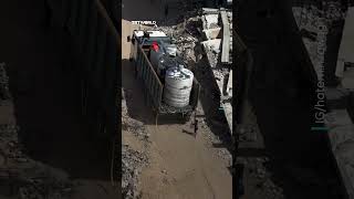 Barefoot Palestinian child chases empty water distribution truck amid Gaza siege