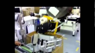 Automatic horizontal round bottle label applicator for tube labeling system