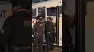 LA protesters loaded onto buses by Marines