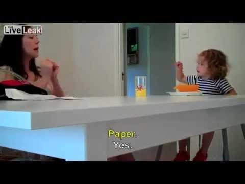 2 years old girl having a conversation with her mom, both are deaf