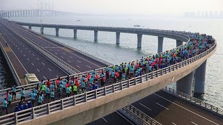 Aerial China: Ocean-view marathon on Jiaozhou Bay Bridge| CCTV English