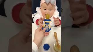 "Safe and fun feeding! Baby fruit feeder for healthy snacking without the mess. 🍓🍎"