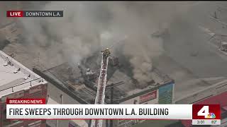 Nearly 100 firefighters battle commercial fire in Downtown LA