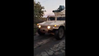 A U.S. supplied HMMWV with a BGM-71 Tow anti-tank missile mounted on top mobilizes on the front